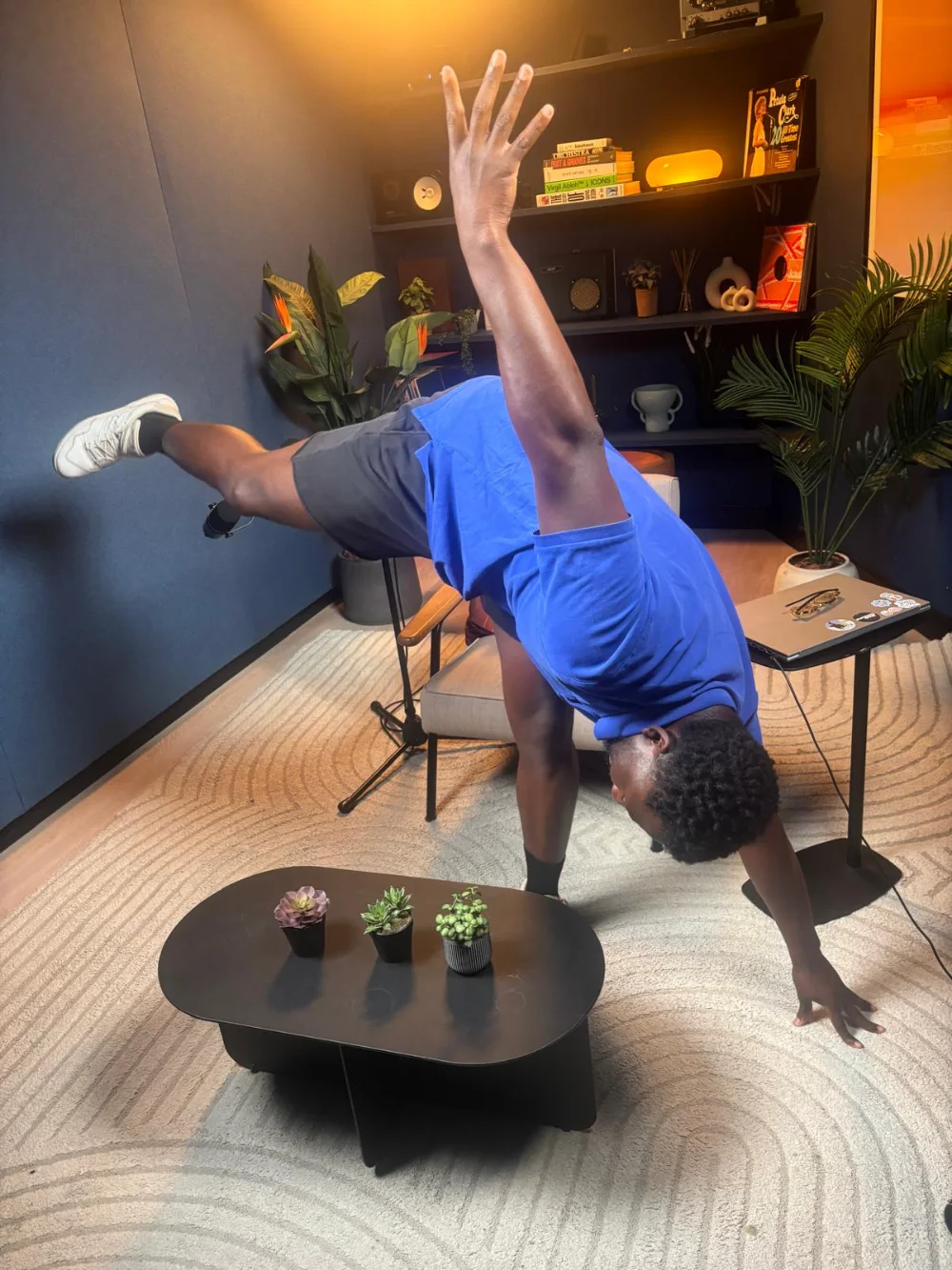 Rich mid-cartwheel in a studio